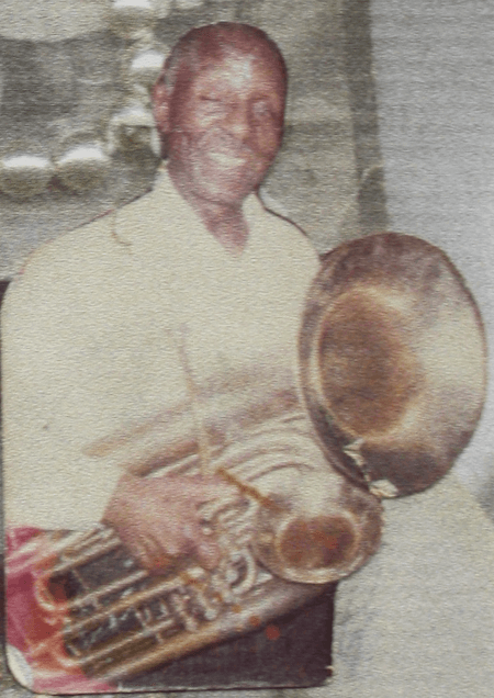 1990 ca DePriest EB Wheeler with tuba.png